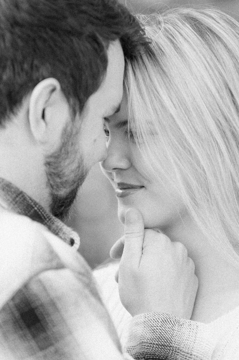 black and white close up of engaged couple 