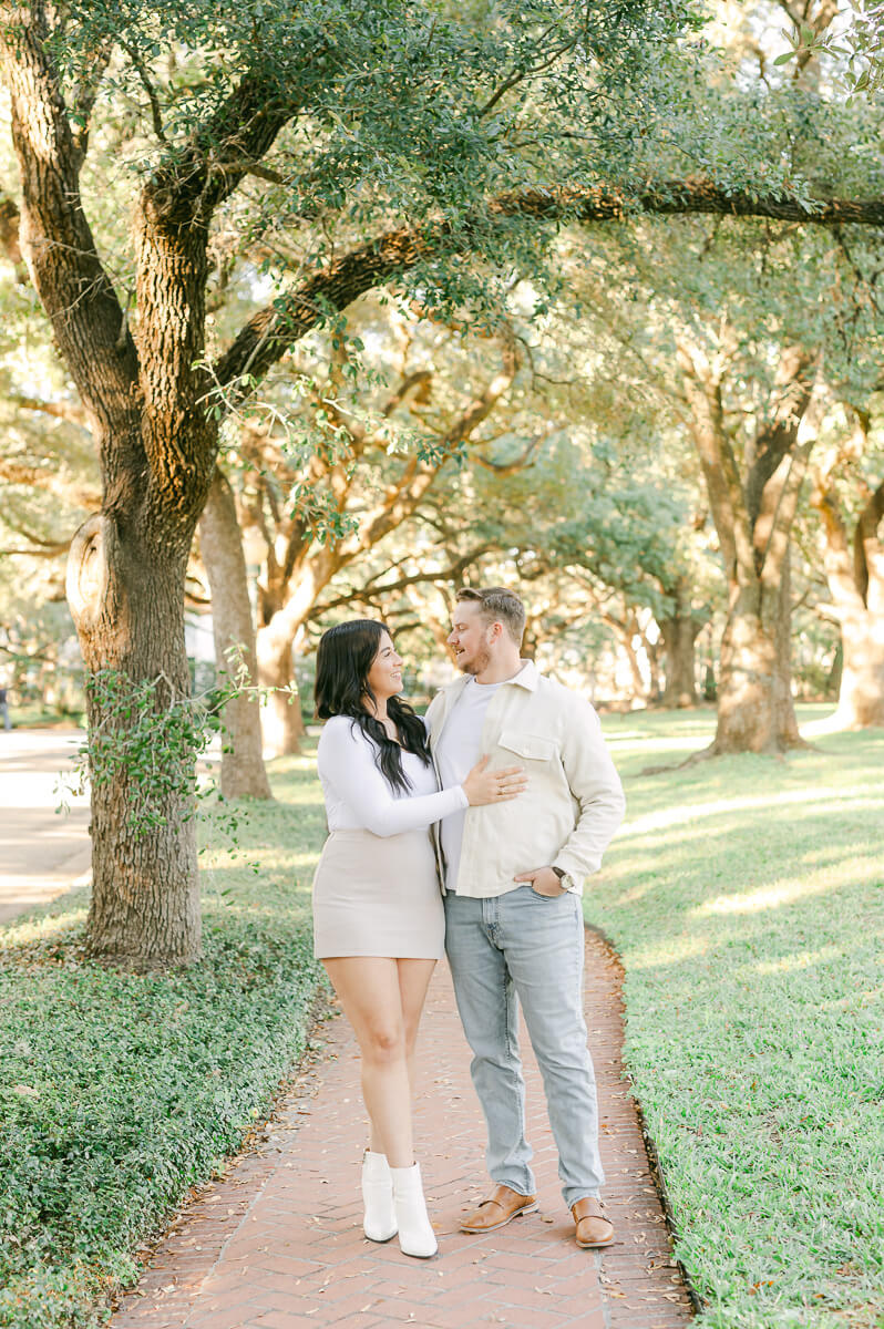 a couple under the trees on North Boulevard in Houston