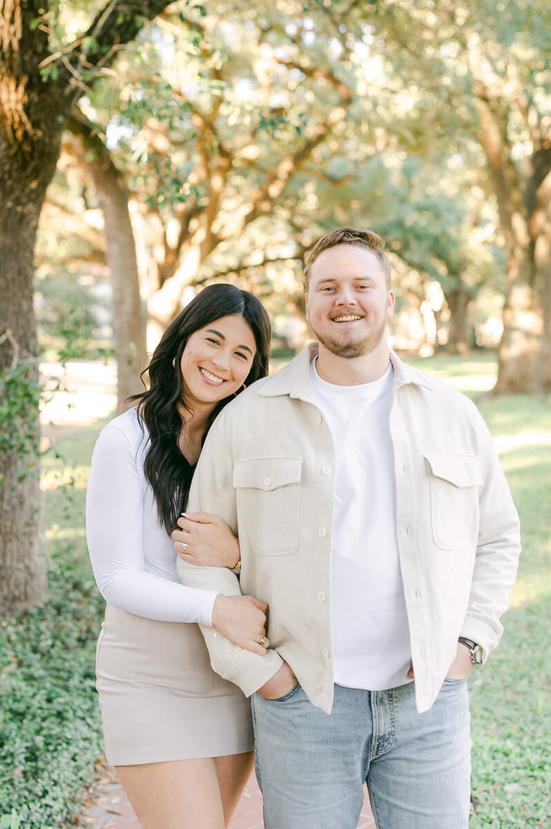 a couple under the trees on North Boulevard in Houston