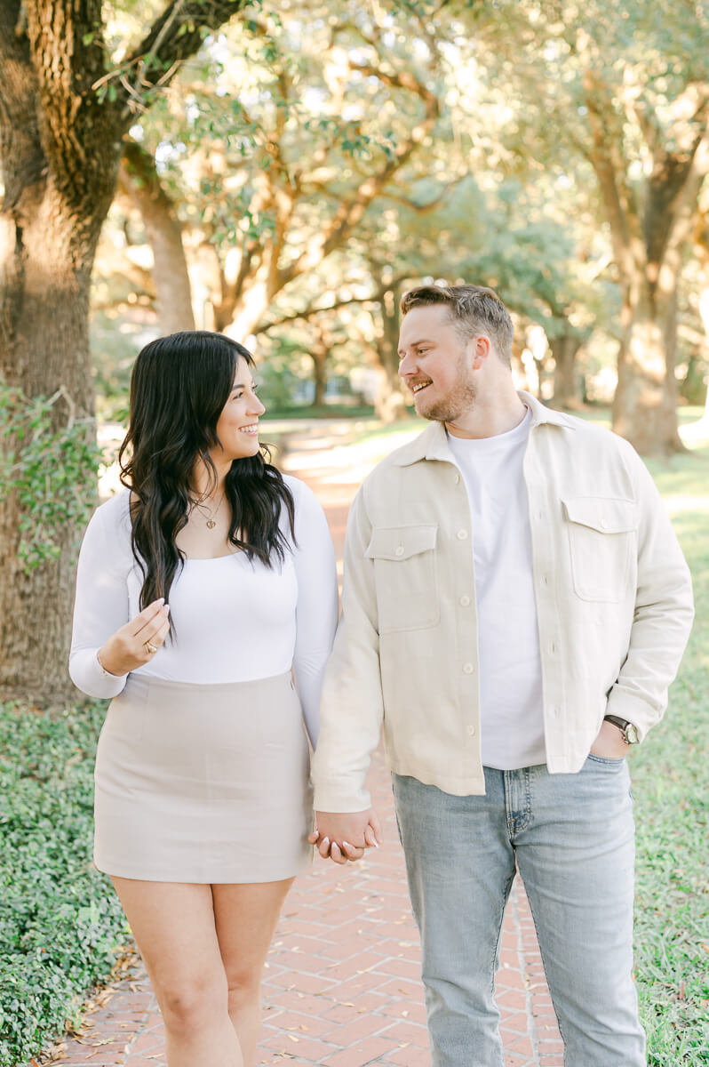 a couple under the trees on North Boulevard in Houston