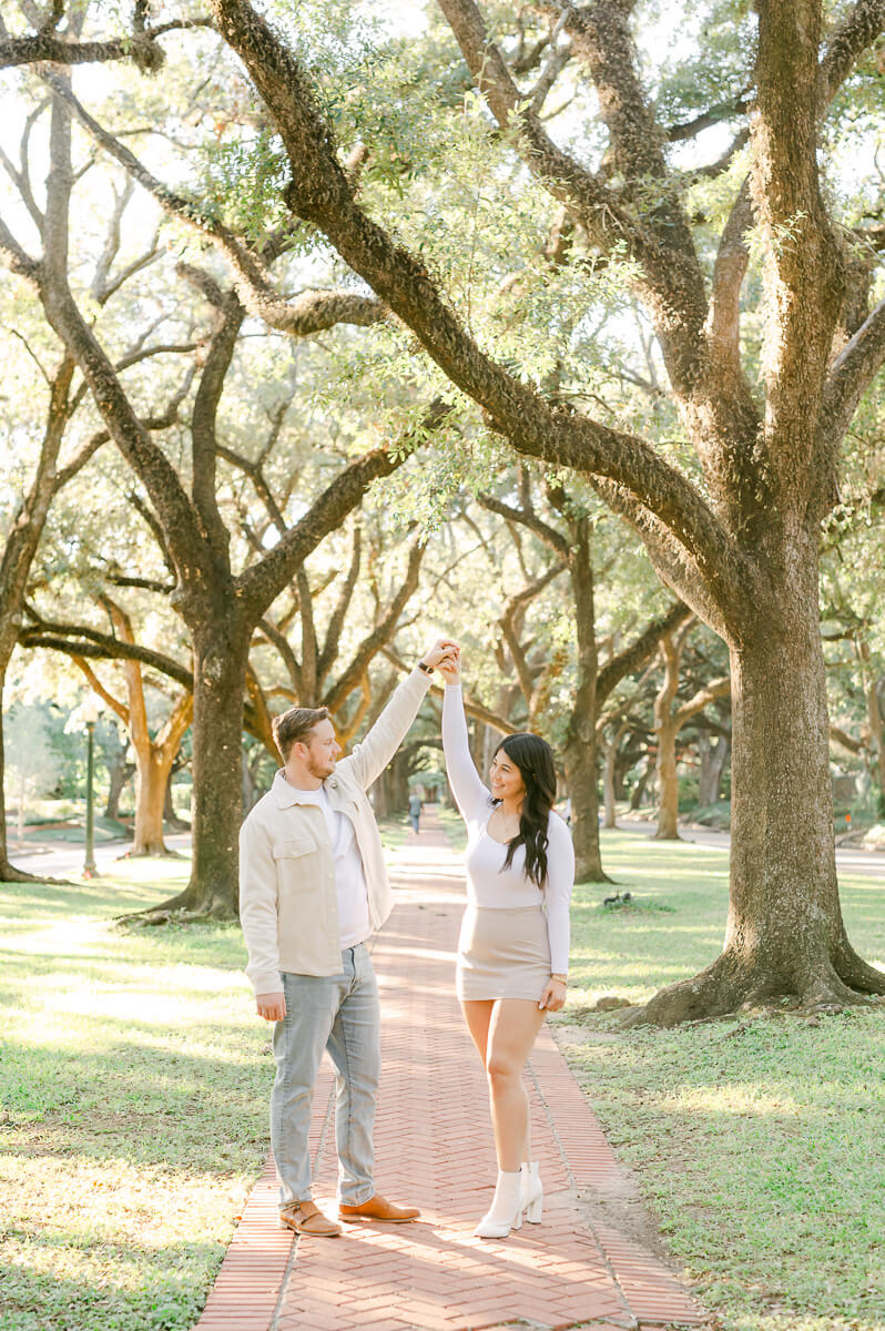 a couple under the trees on North Boulevard in Houston