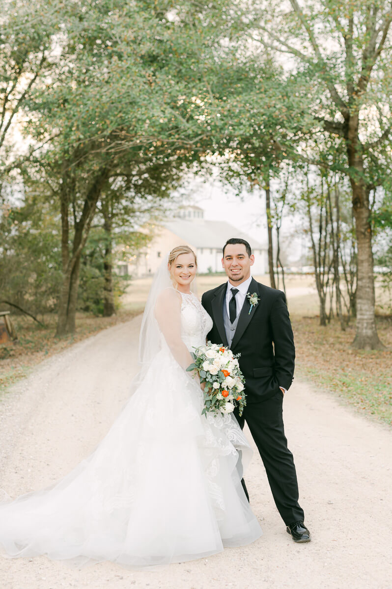 a couple at their wedding at beckendorff farms katy texas