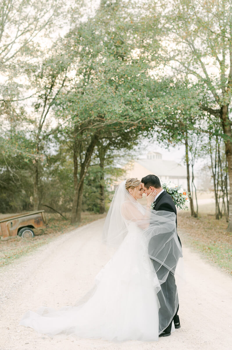 a couple at their wedding at beckendorff farms katy texas