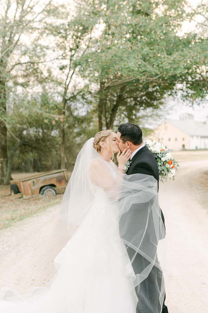 a couple at their wedding at beckendorff farms katy texas