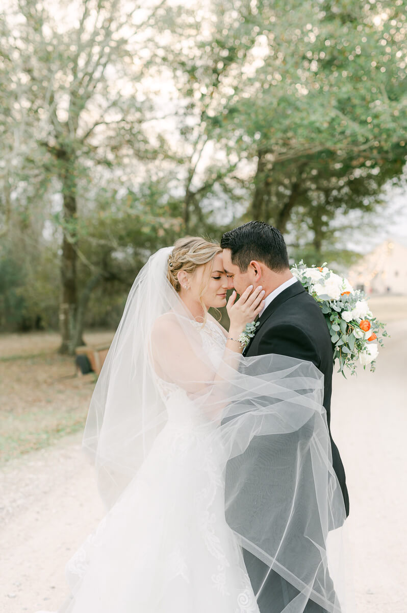 a couple at their wedding at beckendorff farms katy texas