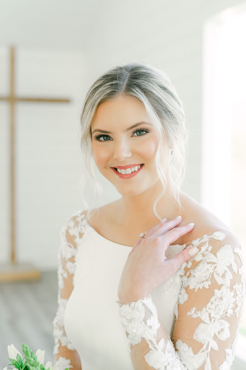 a bride inside the chapel at the farmhouse wedding venue