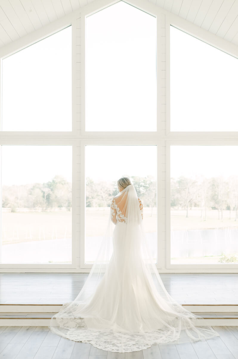 a bride inside the chapel at the farmhouse wedding venue