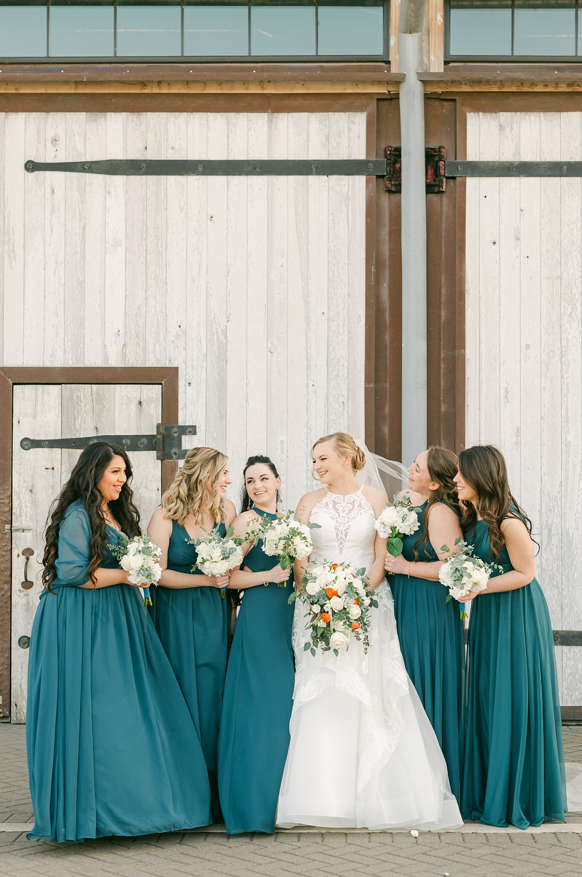 bridesmaids holding white flowers at beckendorff farms Katy 