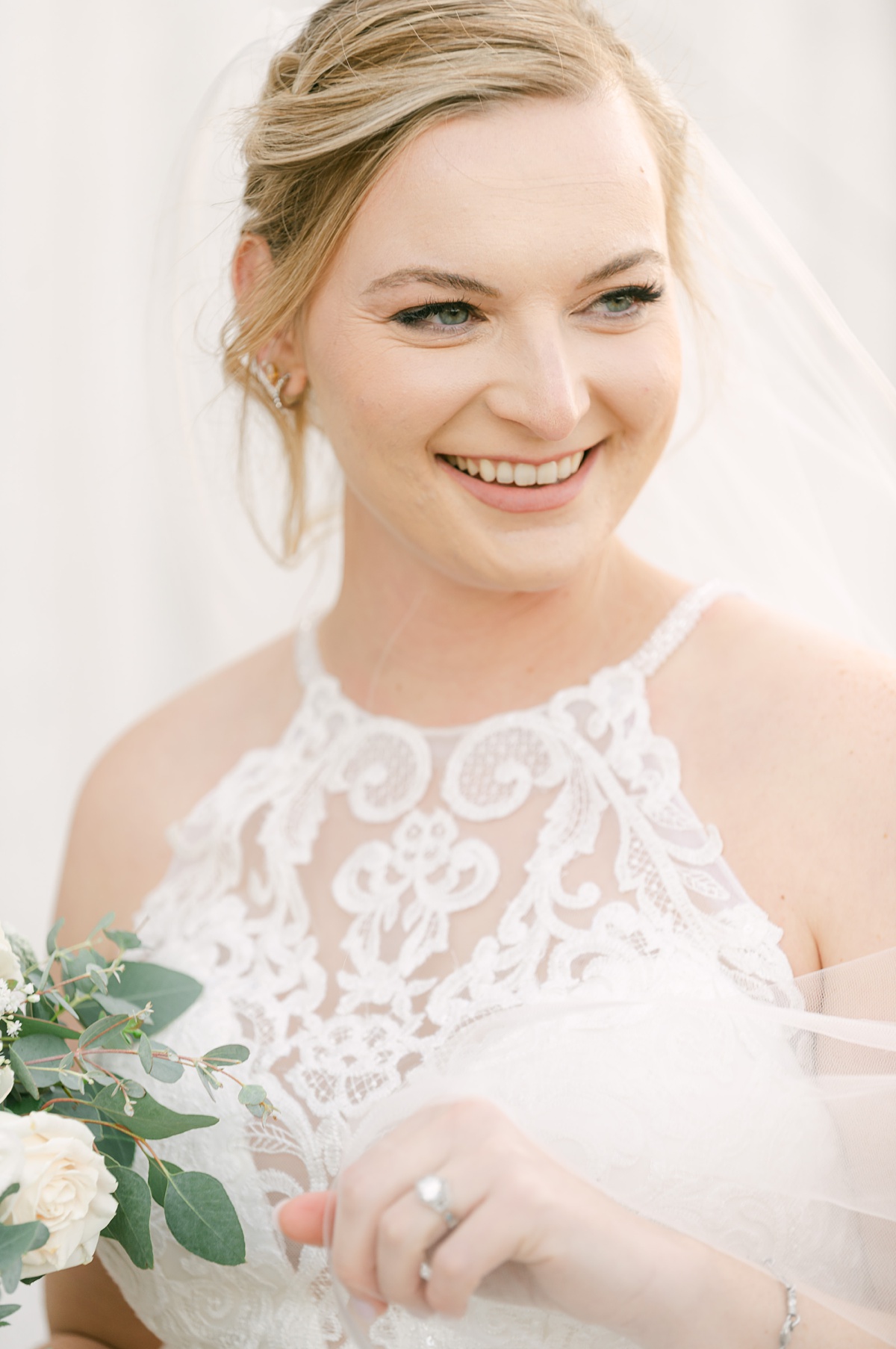 a bride smiling on her wedding day