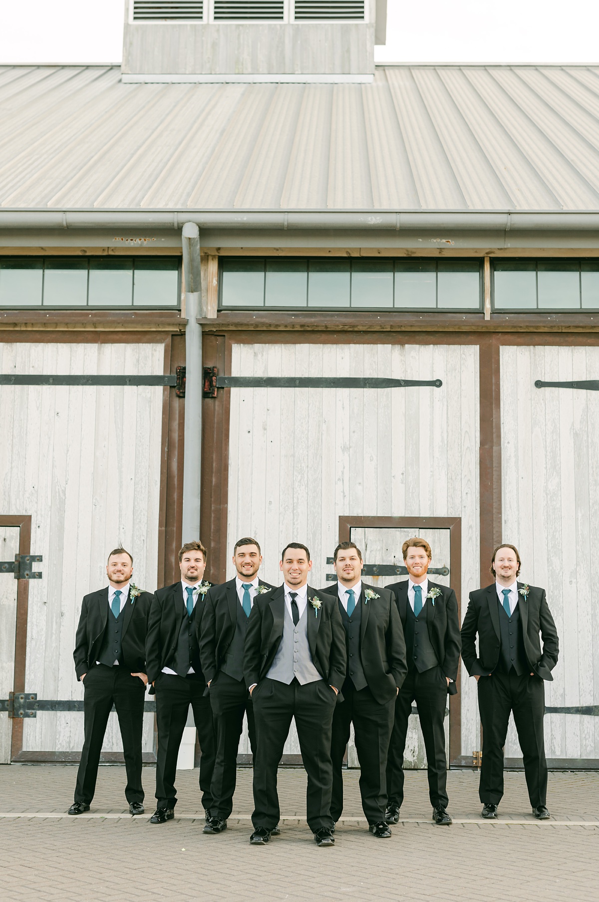 groomsmen with hands in pockets at Katy wedding venue