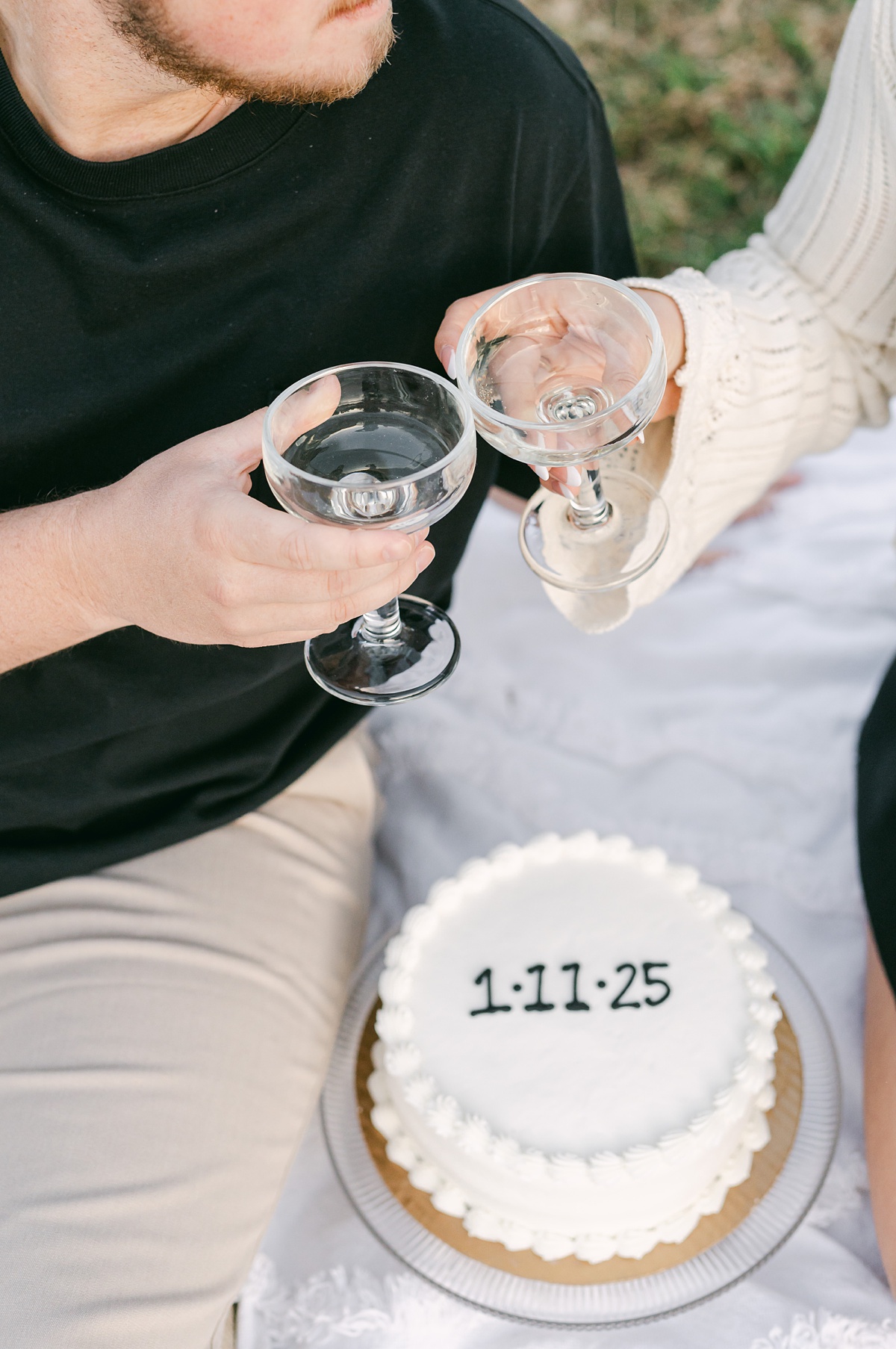 a couple with cake and champagne at their downtown houston engagement session