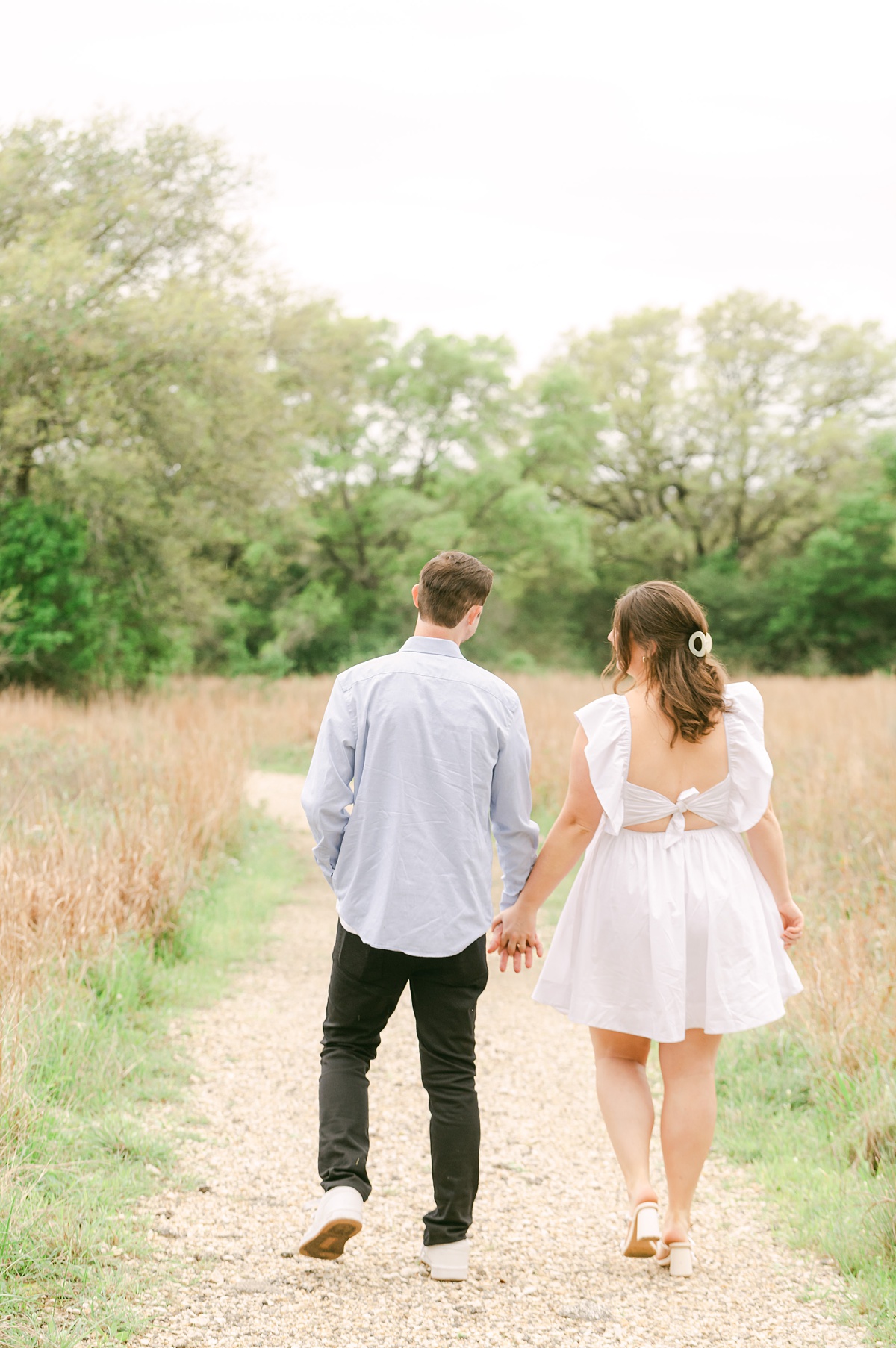 couple walking at their houston engagement session 