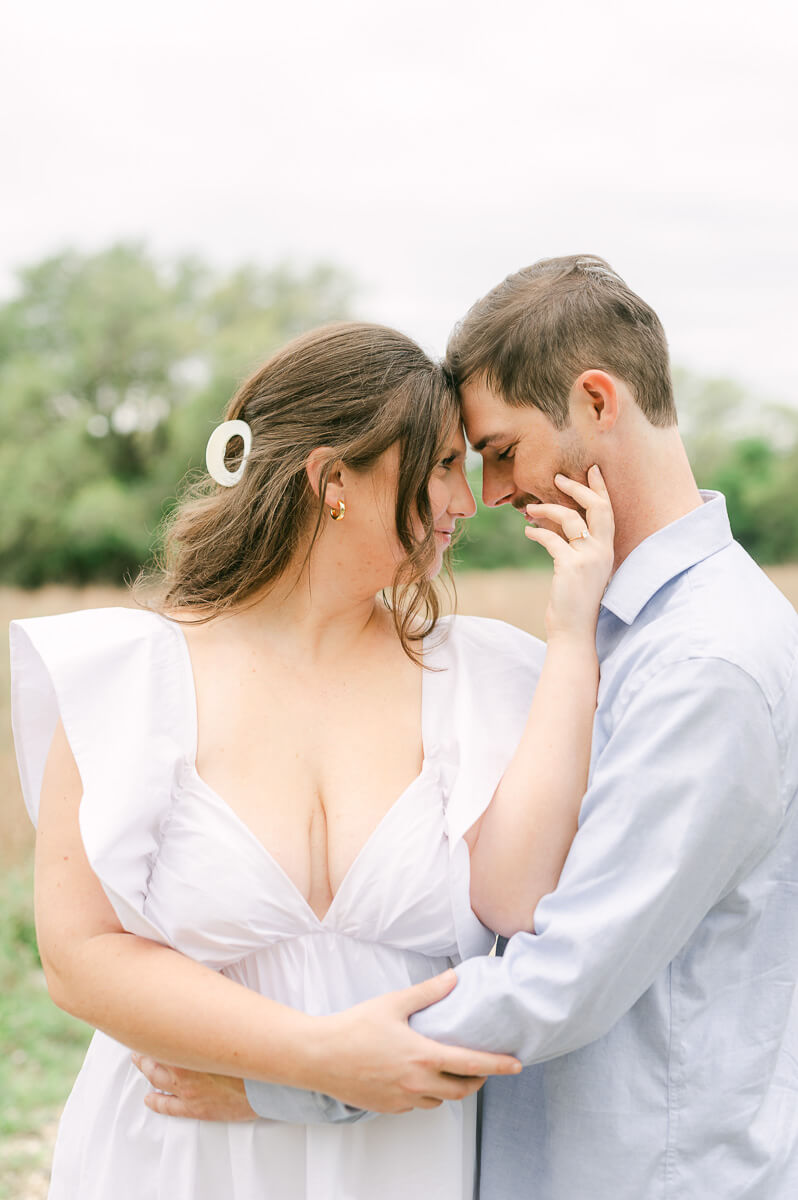 couple cuddling at brazos bend state park