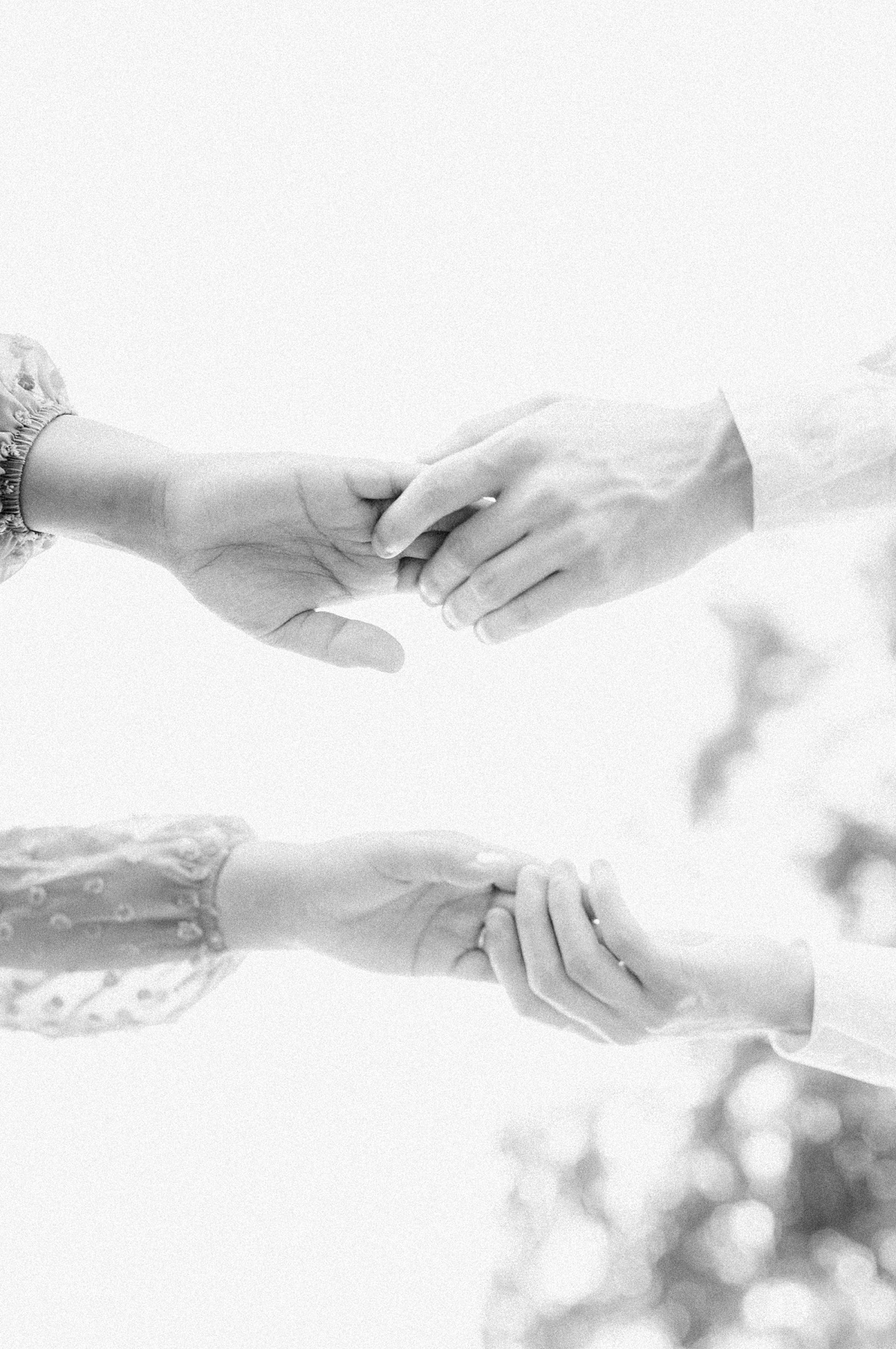 black and white photo of hands from an engagement session