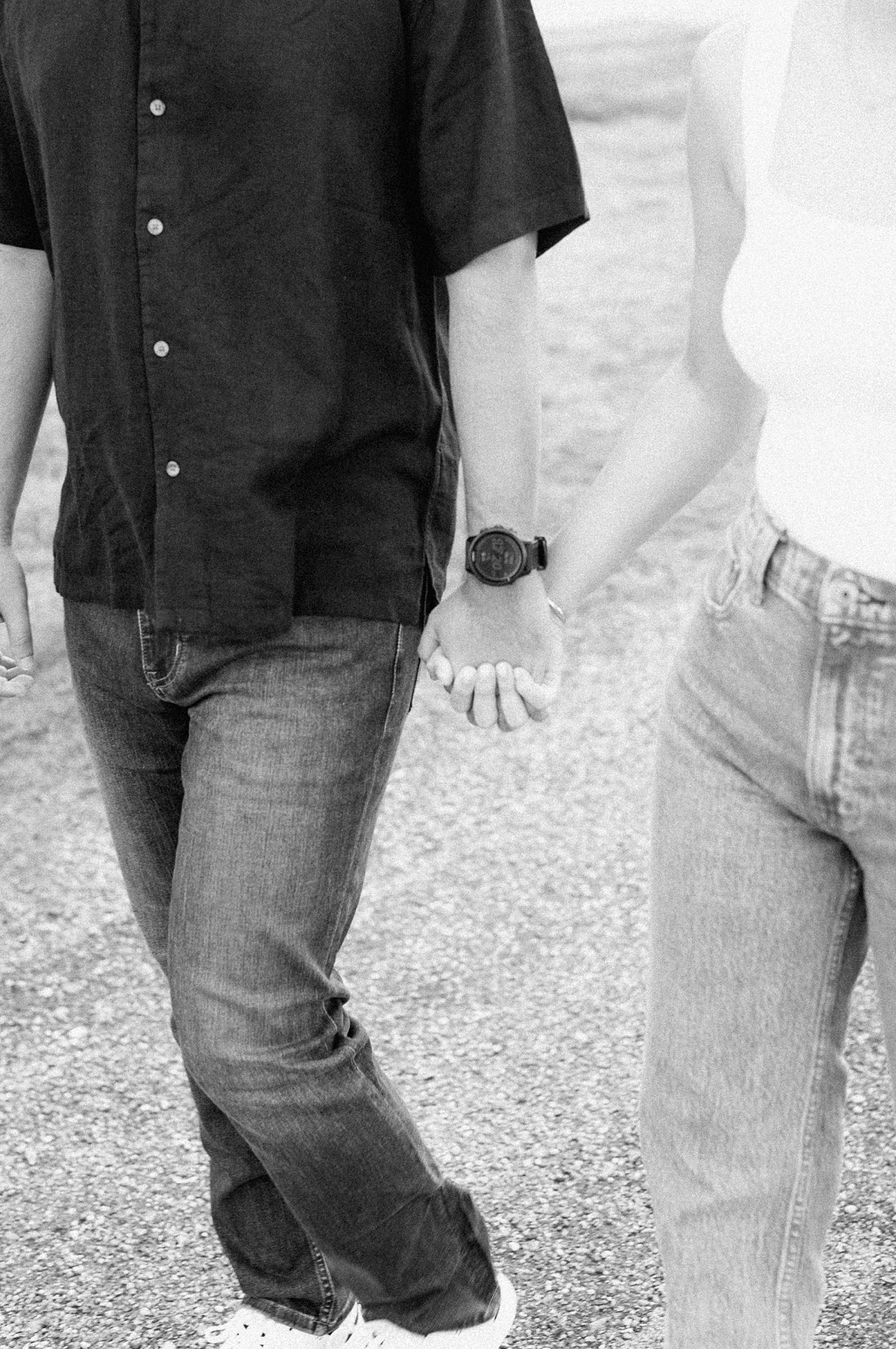 black and white photo of couple holding hands during their Houston engagement session
