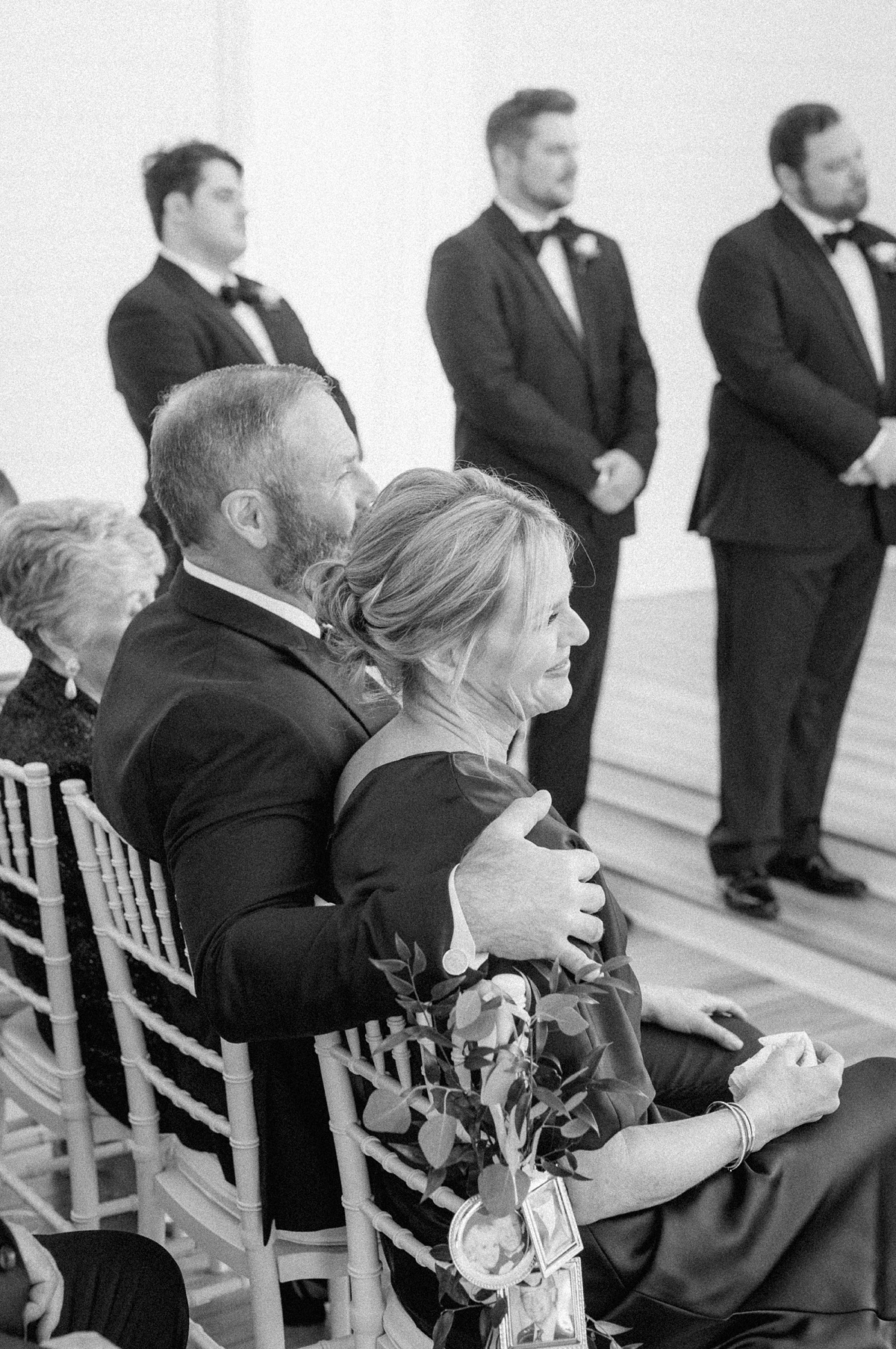 the parents of the bride watching her get married