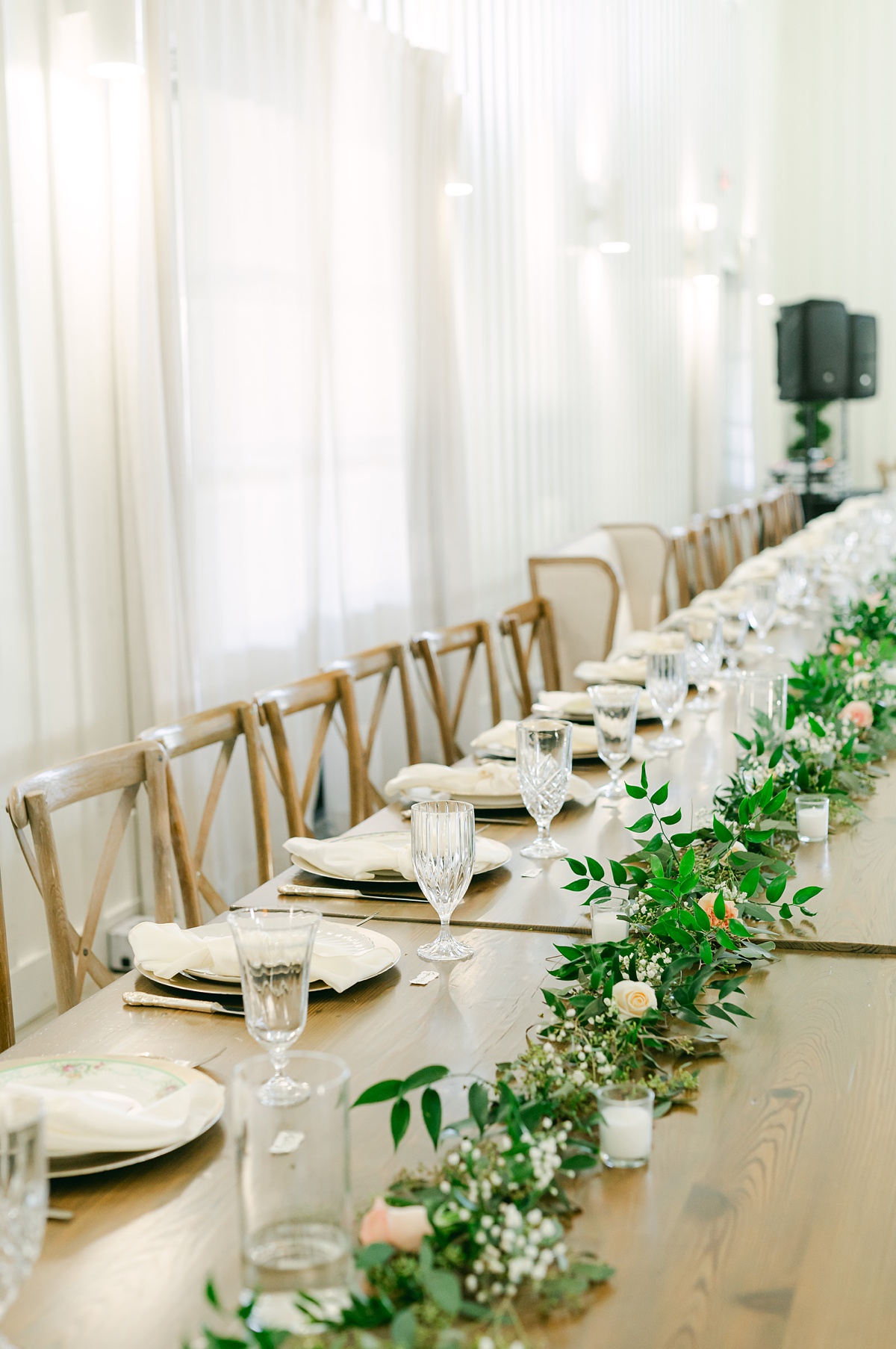 greenery and crystal china table setting for a farmhouse bride