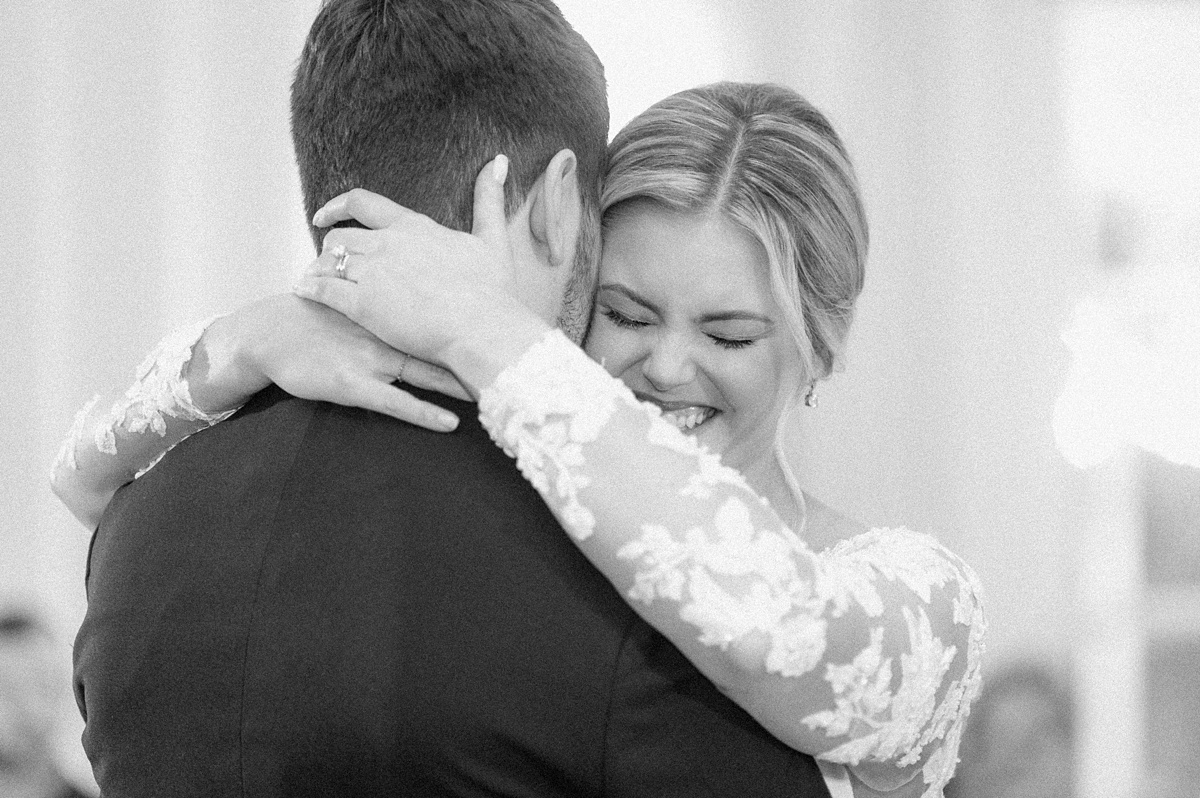 a bride smiling during the first dance