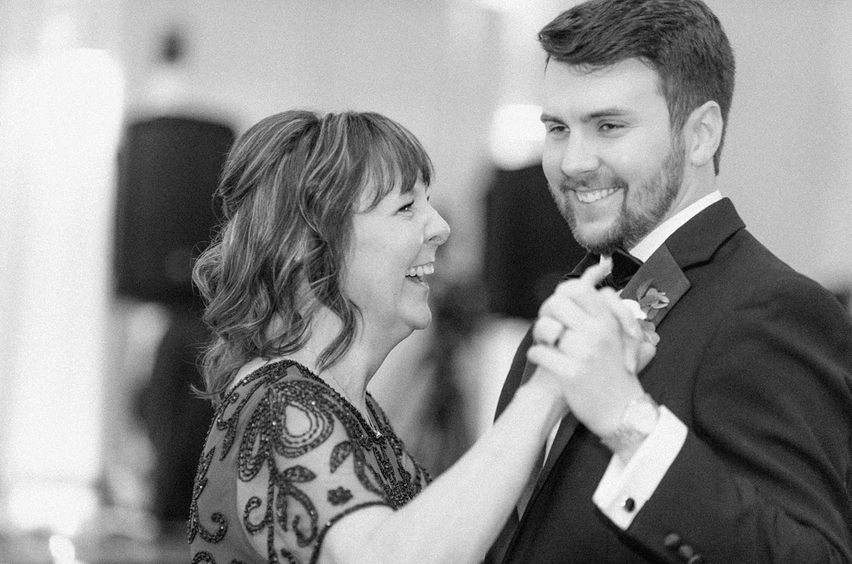 a groom dancing with his mom