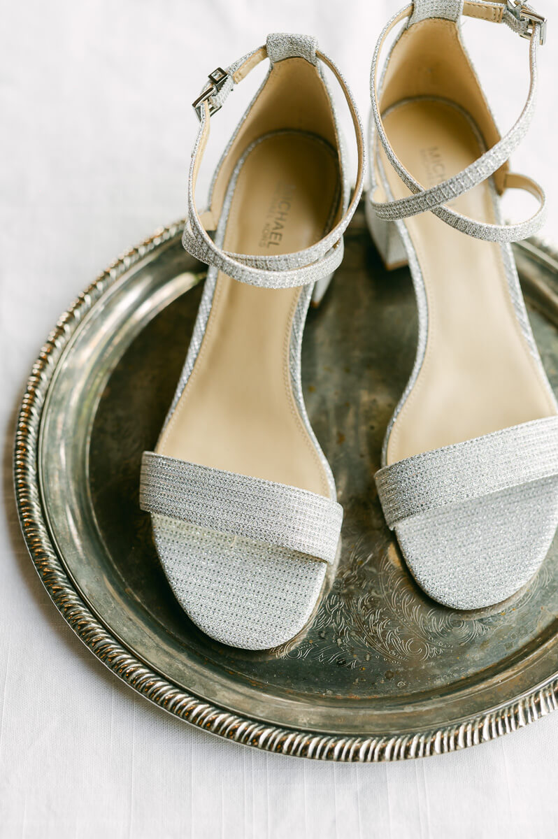 wedding shoes on gold platter