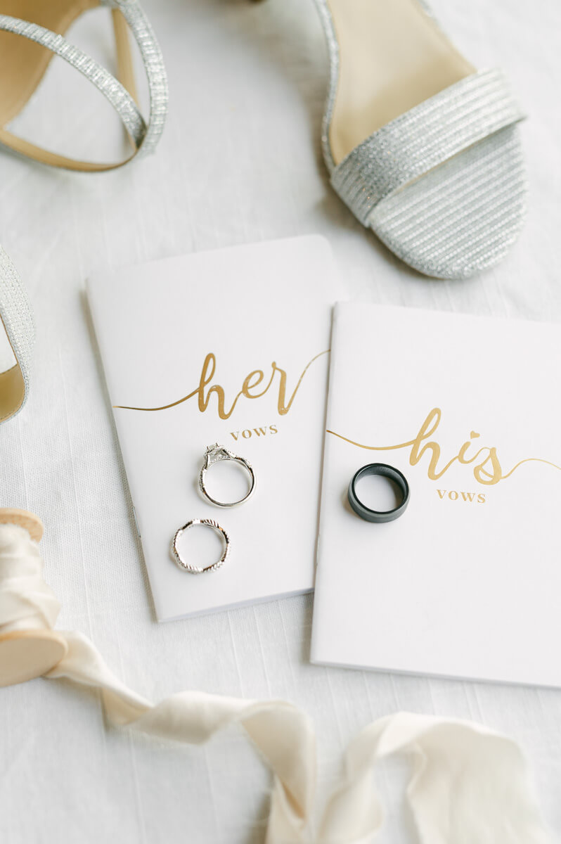 vow books with wedding rings