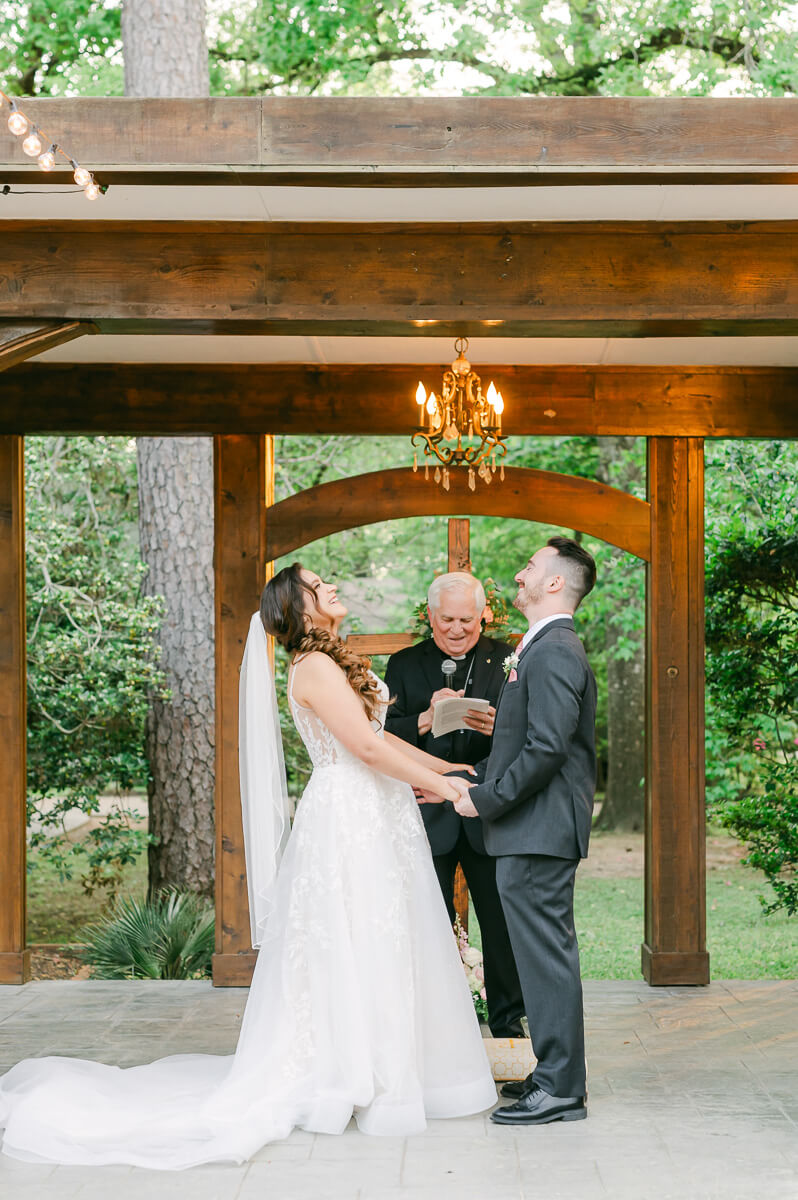 couple laughing during garden ceremony in Houston