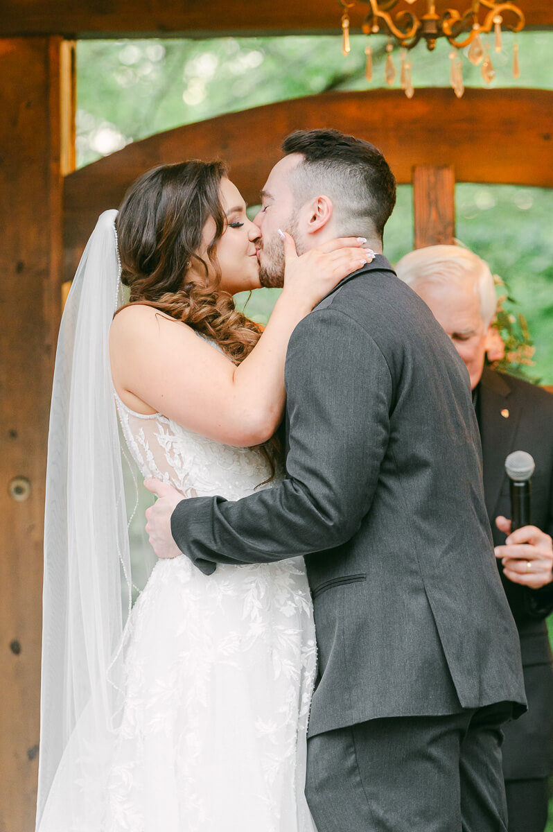 couple's first kiss during garden ceremony in Houston