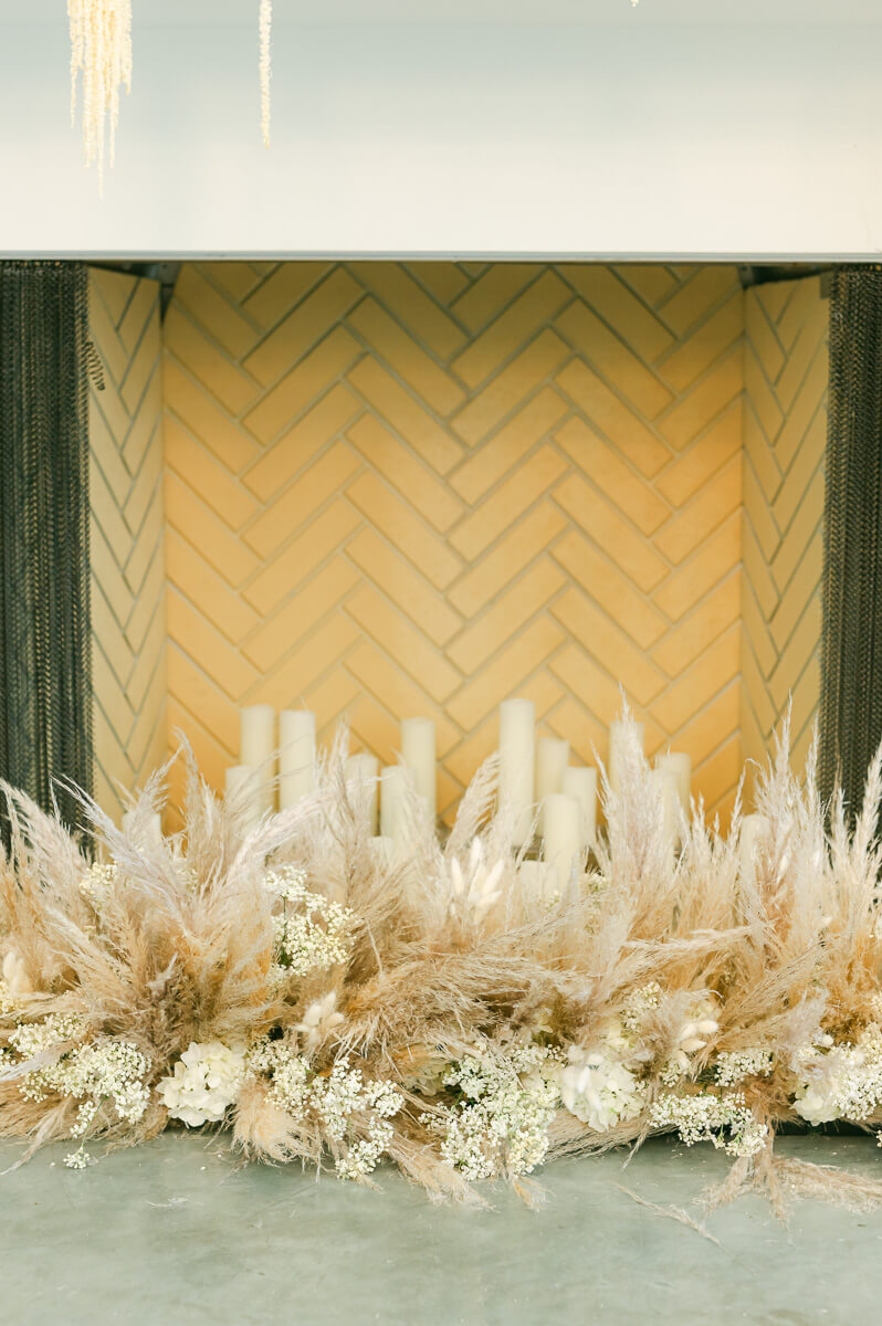 pompas grass in front of fireplace