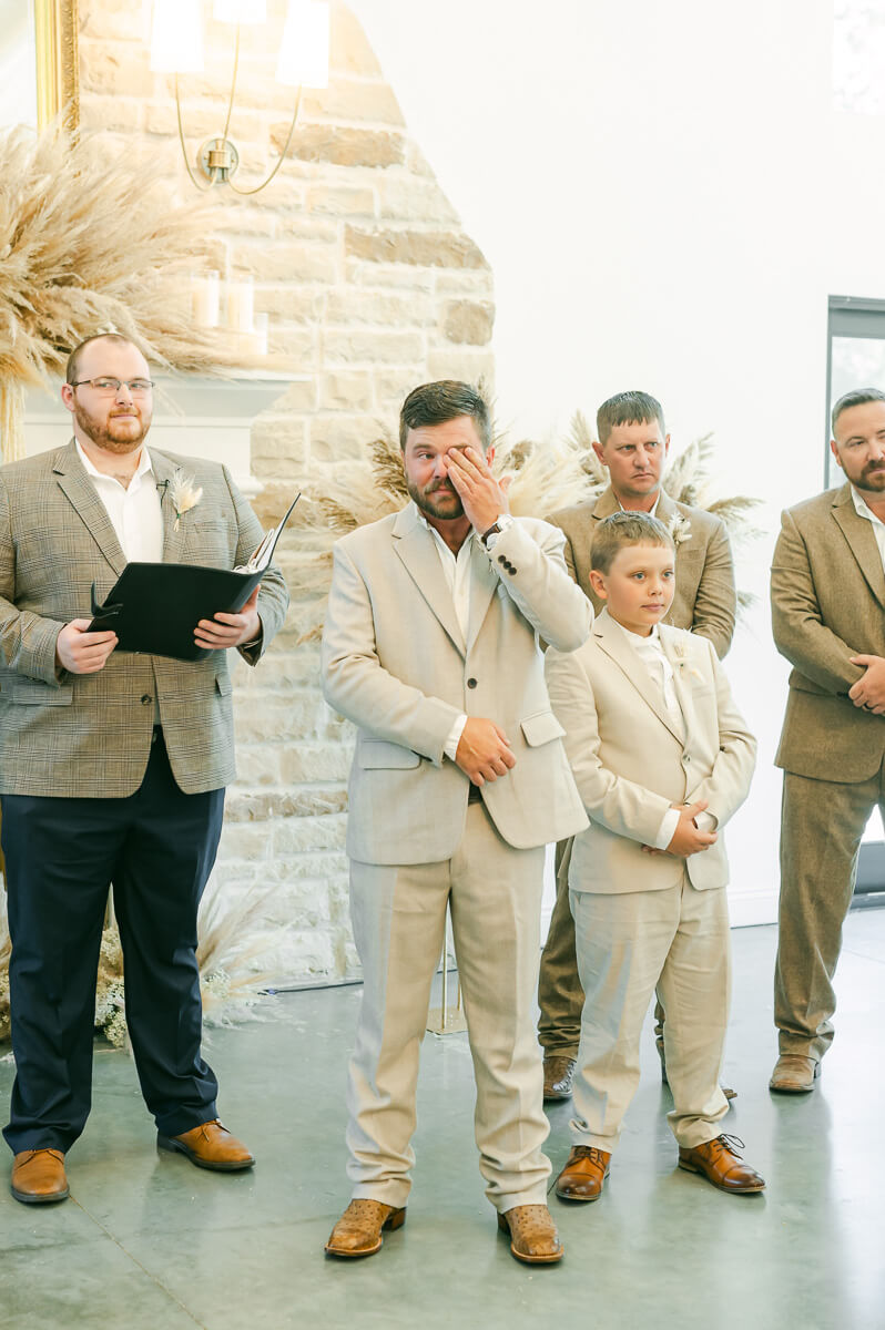 groom crying when the bride's walks up the aisle