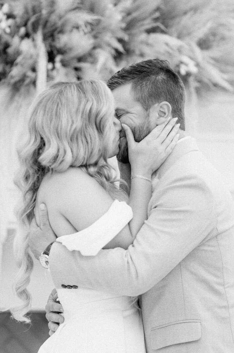 bride and groom first kiss at ceremony