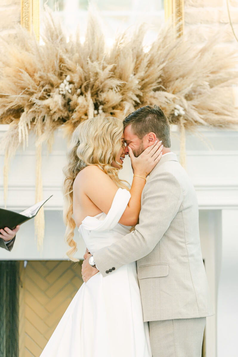bride and groom first kiss at ceremony