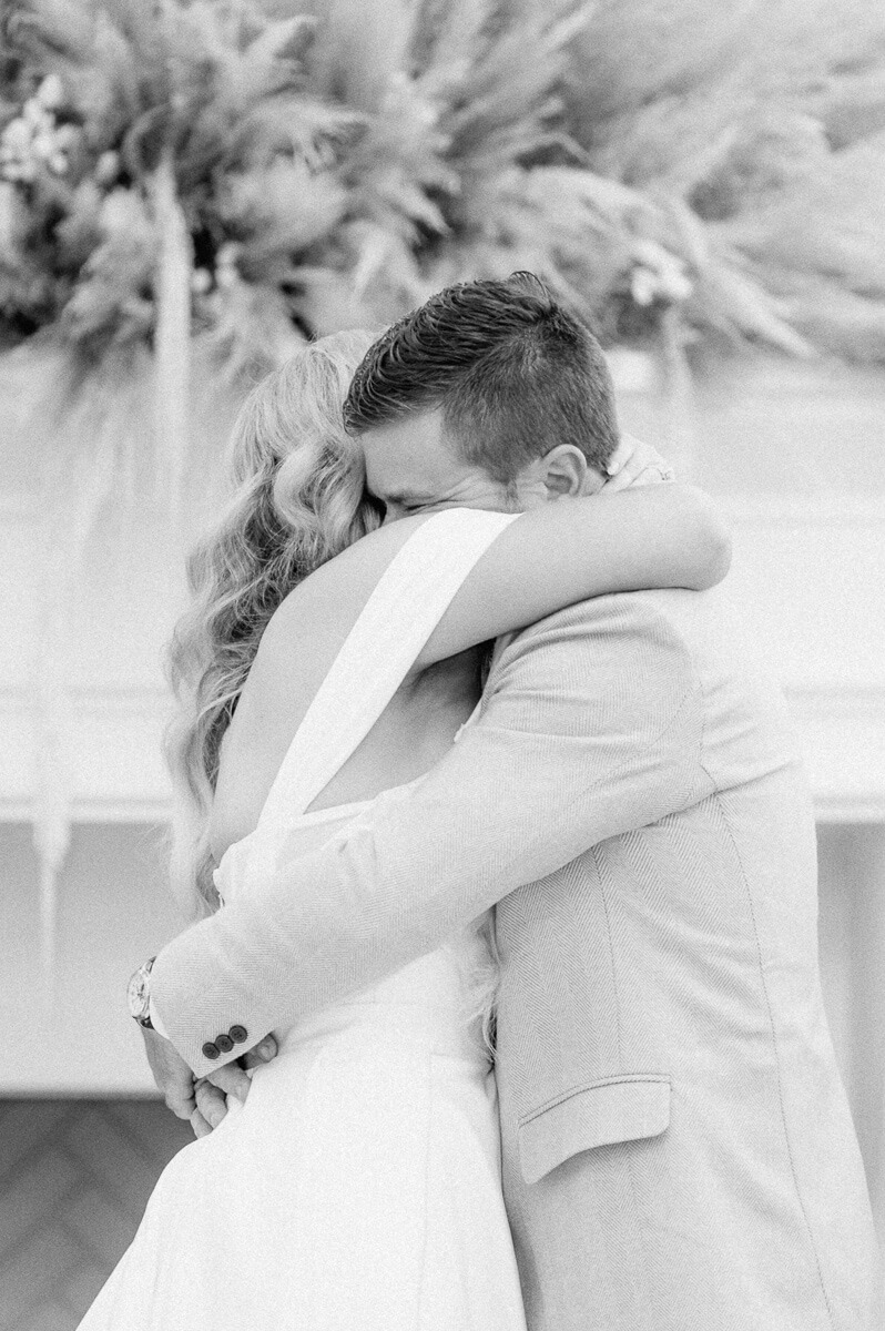 bride and groom hugging after ceremony