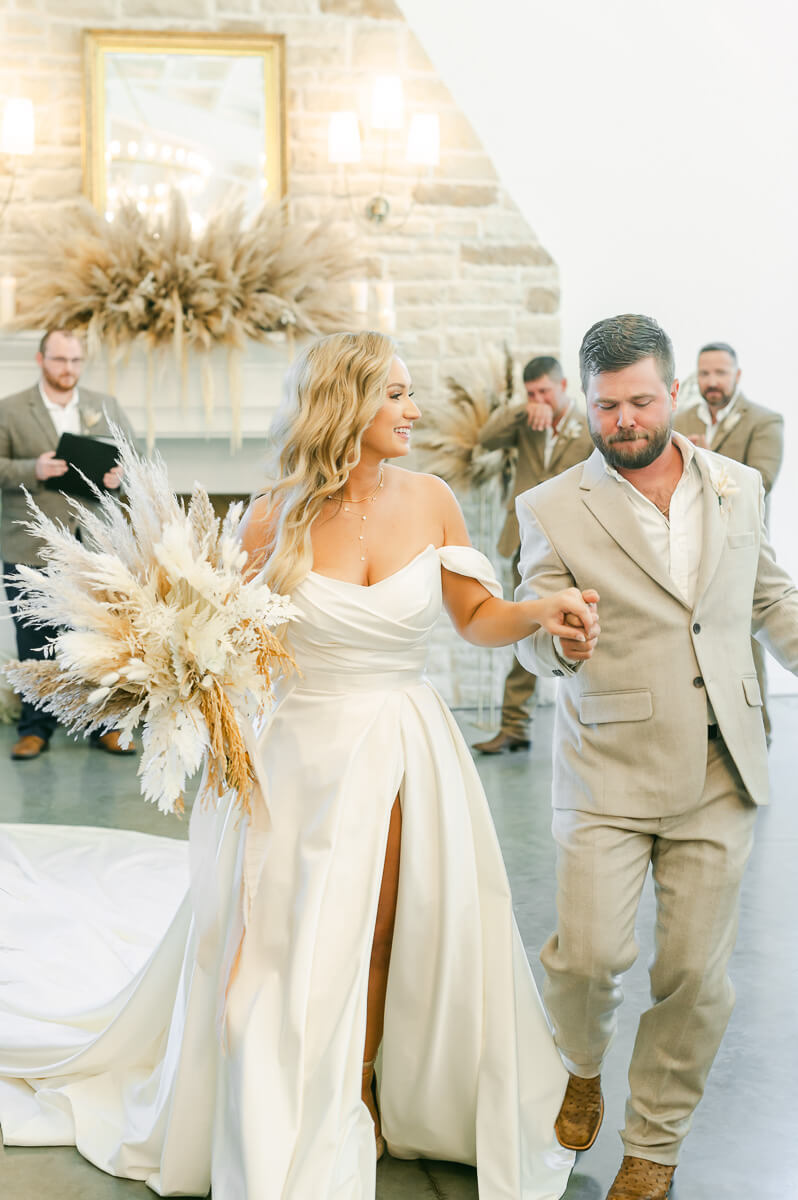 bride and groom leaving after ceremony