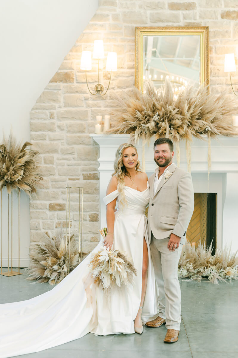 bride and groom in front of fireplace at Magnolia Grove