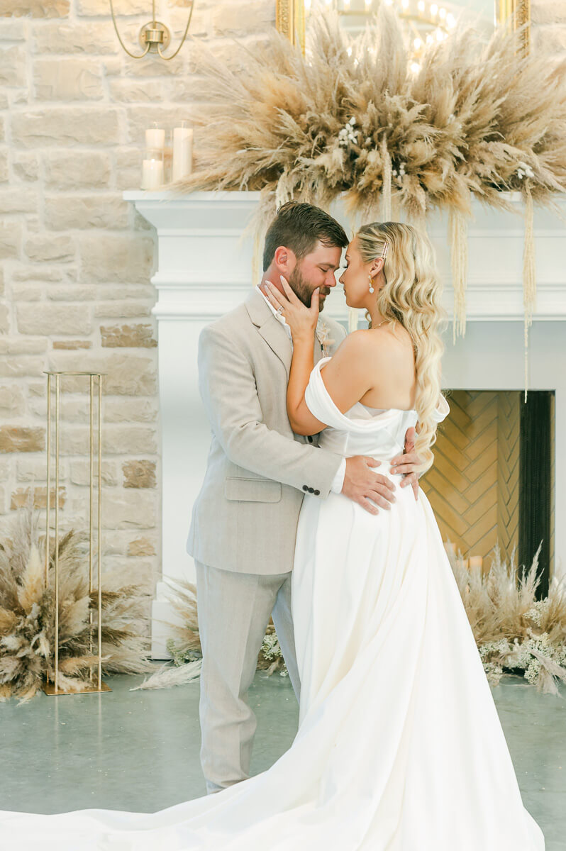 bride and groom in front of fireplace at Magnolia Grove