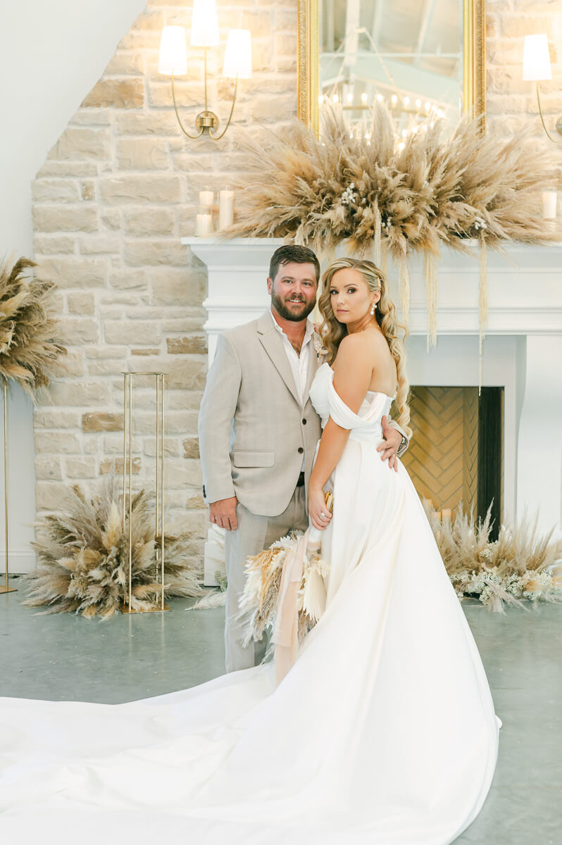 bride and groom in front of fireplace at Magnolia Grove