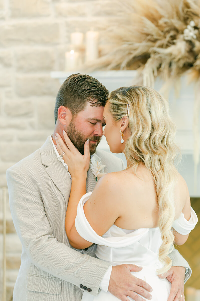 couple cuddling on wedding day