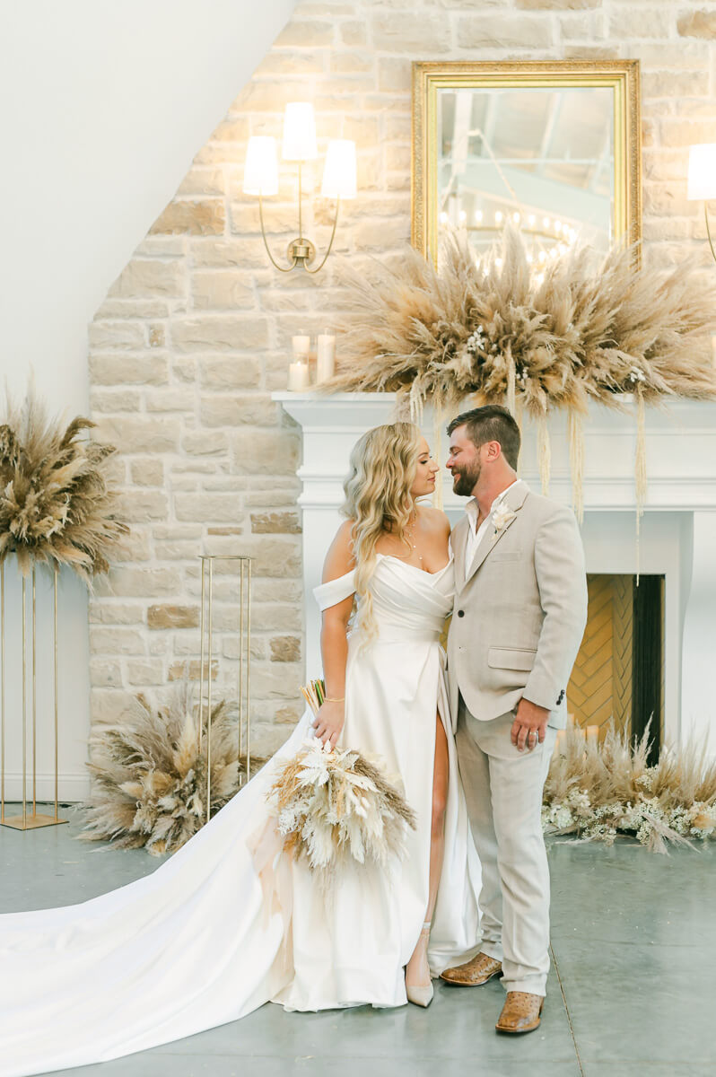 bride and groom in front of fireplace at Magnolia Grove