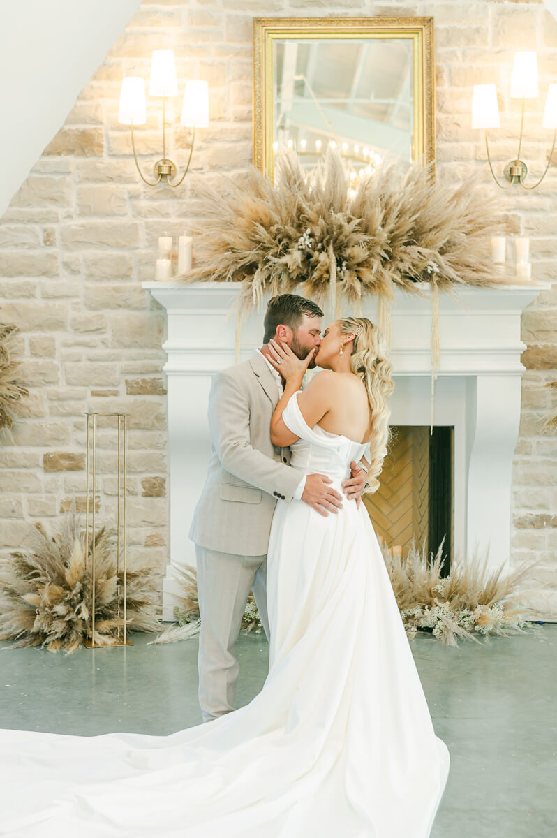 bride and groom in front of fireplace at Magnolia Grove