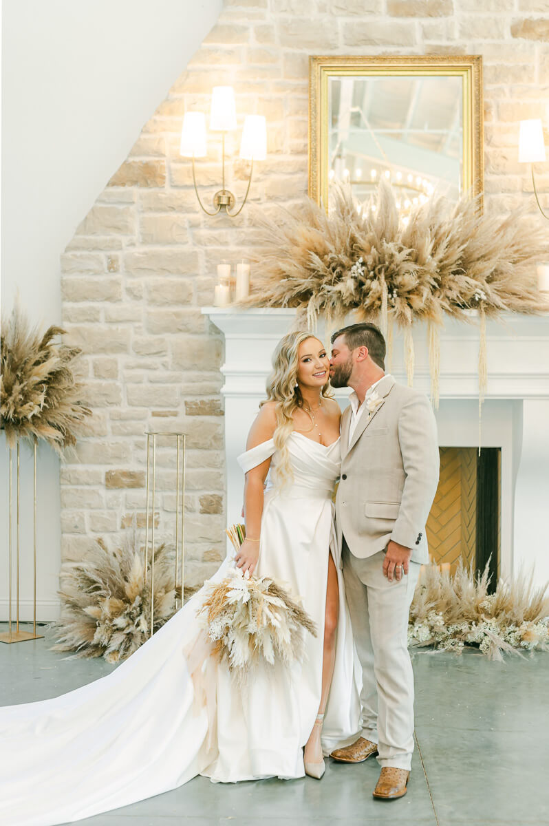 bride and groom in front of fireplace at Magnolia Grove