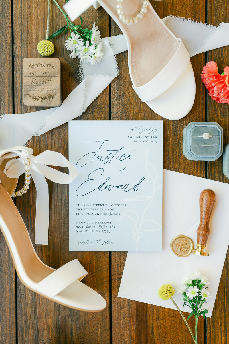 wedding invitation and details inside magnolia meadows wedding chapel