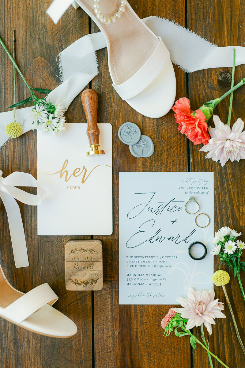 wedding invitation and details inside magnolia meadows wedding chapel