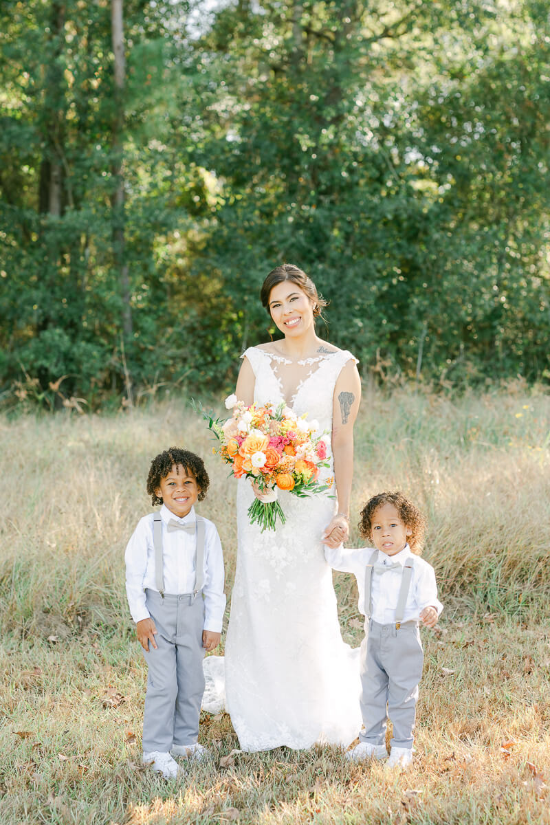 bride and two sons on wedding day