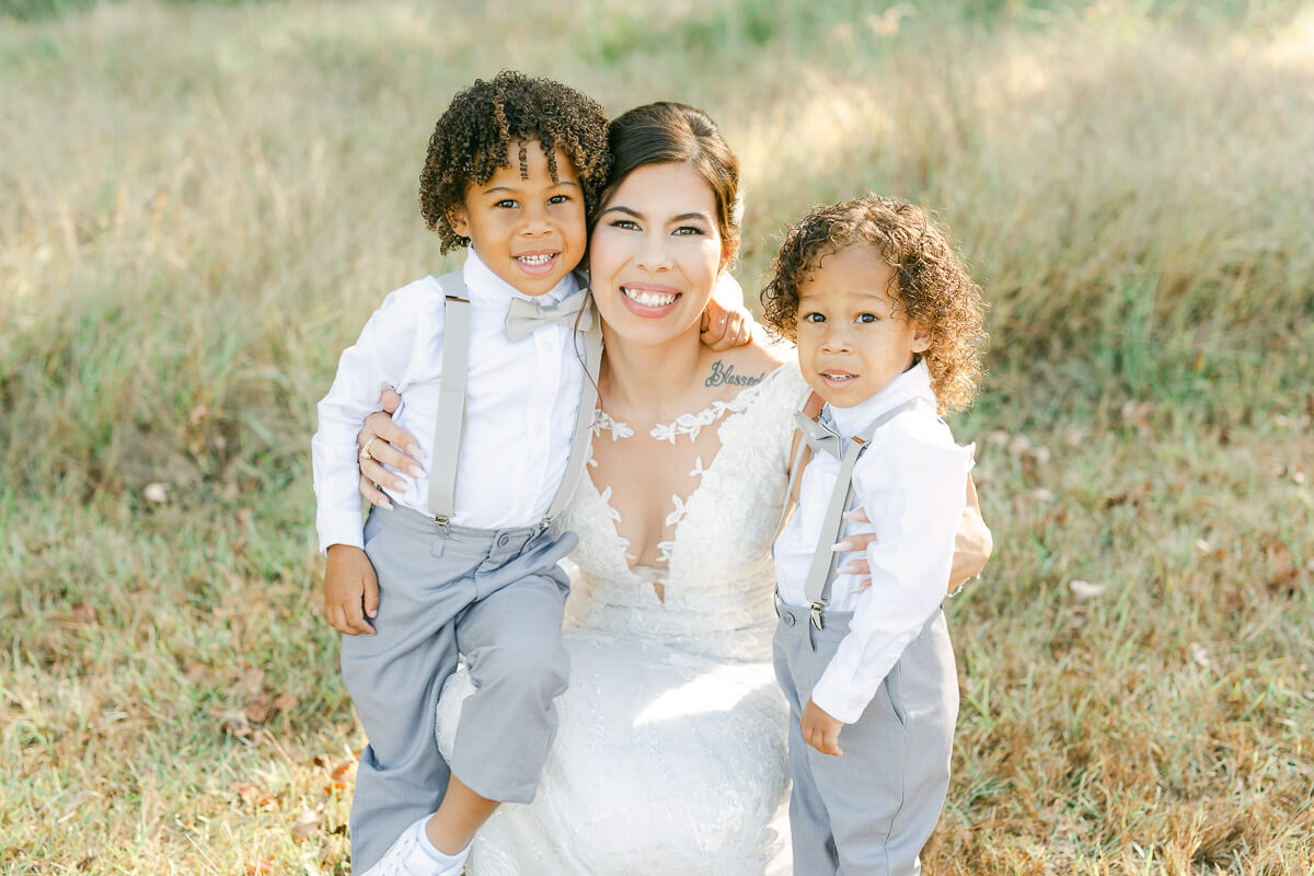 bride and two sons on wedding day