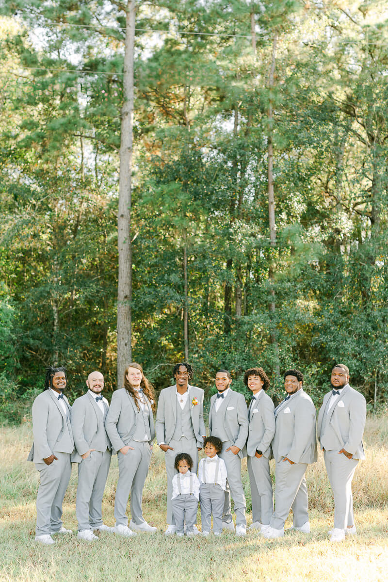 groomsmen wearing grey suits at magnolia meadows 