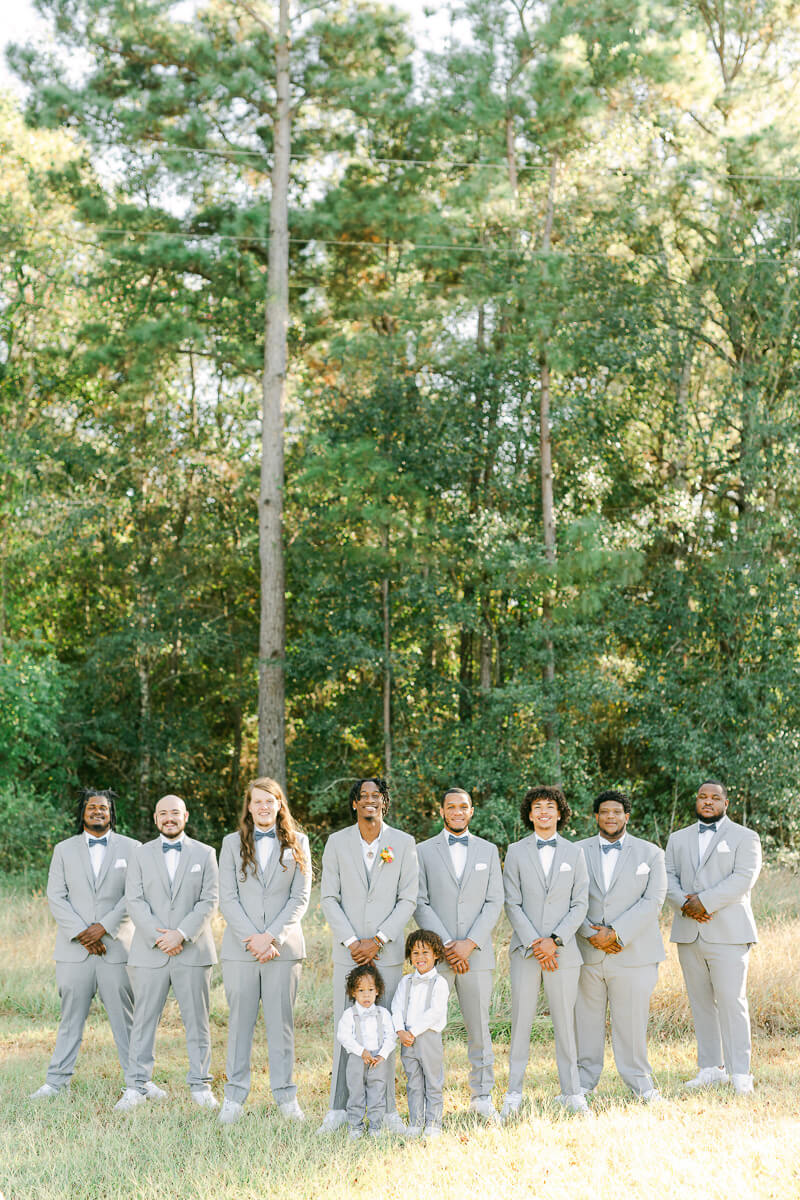 groomsmen wearing grey suits at magnolia meadows 