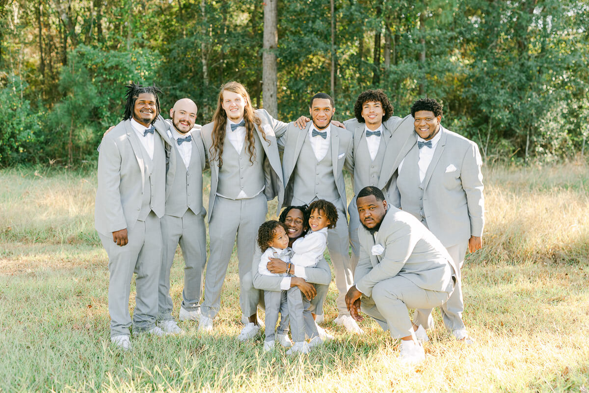 groomsmen wearing grey suits at magnolia meadows 