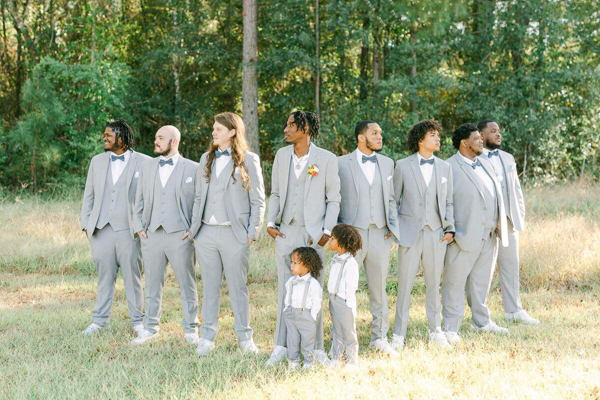 groomsmen wearing grey suits at magnolia meadows 