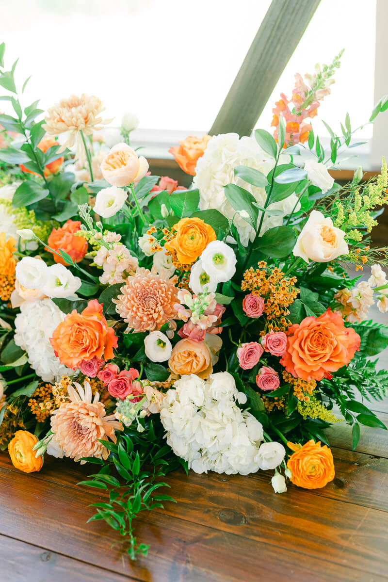 bright florals inside the magnolia meadows wedding chapel