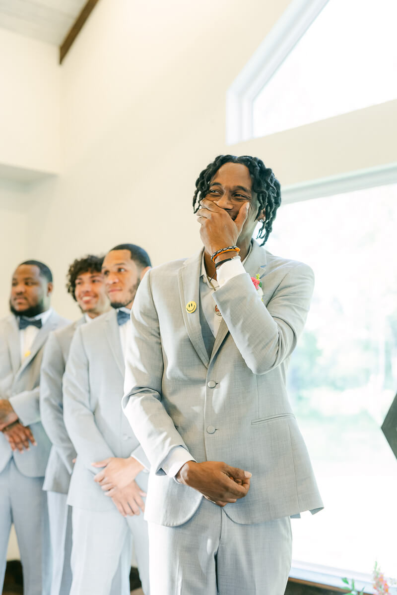 groom seeing his bride walk up the aisle at magnolia meadows 